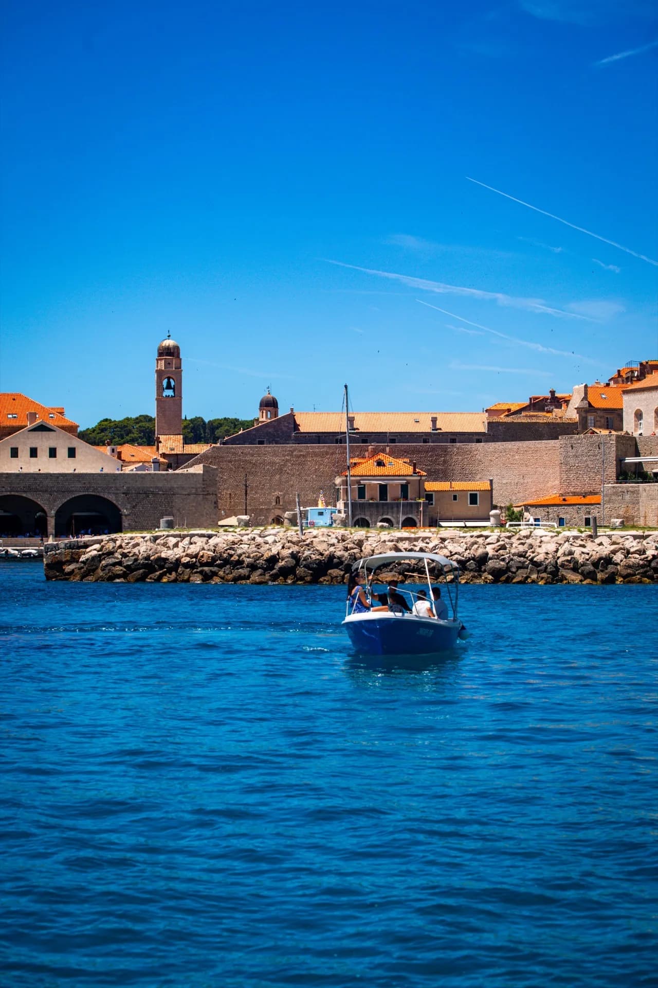 Visitors exploring caves during a Dubrovnik boat excursion